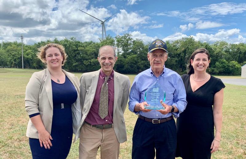 At the Aug. 15 Clean Power Champion Award presentation are (l-r) A.R. Siders, co-director of UD’s Gerard J. Mangone Climate Change Science and Policy Hub; Jeremy Firestone, professor in the School of Marine Science and Policy professor and former UD Center for Research in Wind director; Sen. Tom Carper; and Moira Cyphers, Eastern State Affairs director for American Clean Power Association. SUBMITTED PHOTO